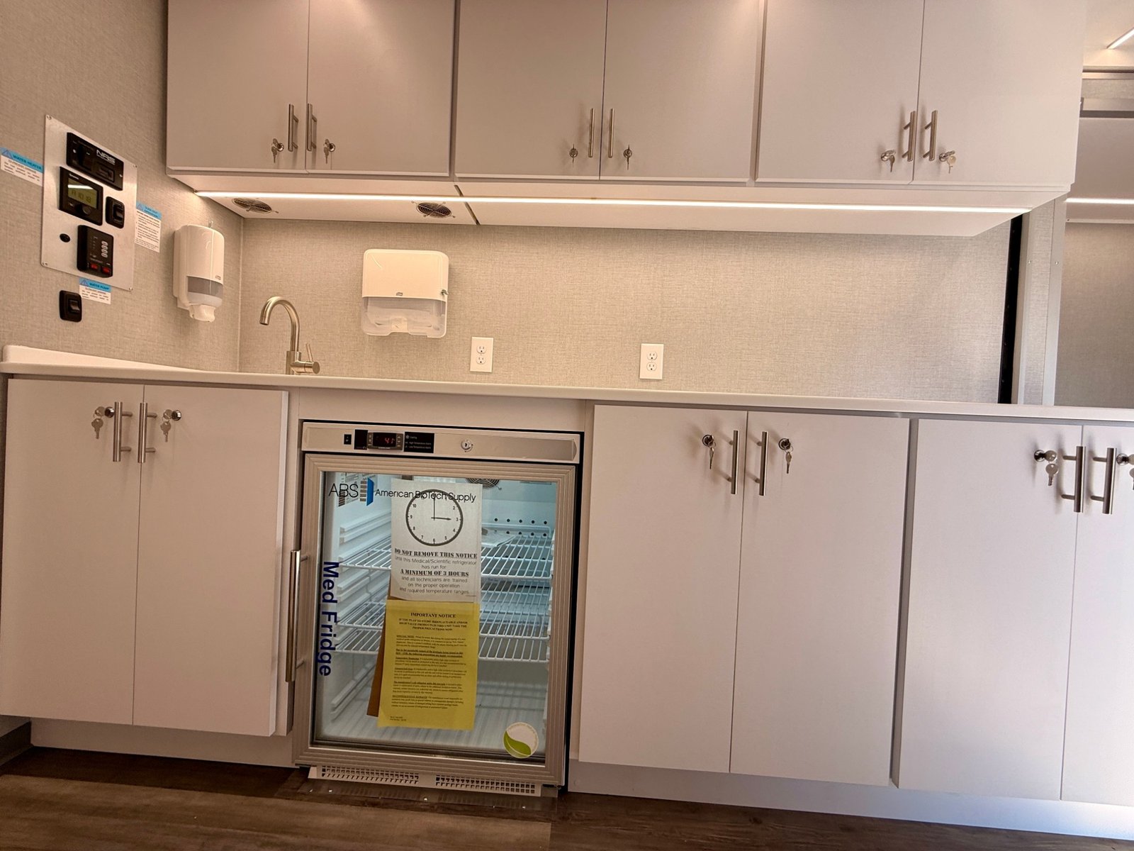 Medical refrigerator and locking upper and lower cabinet storage