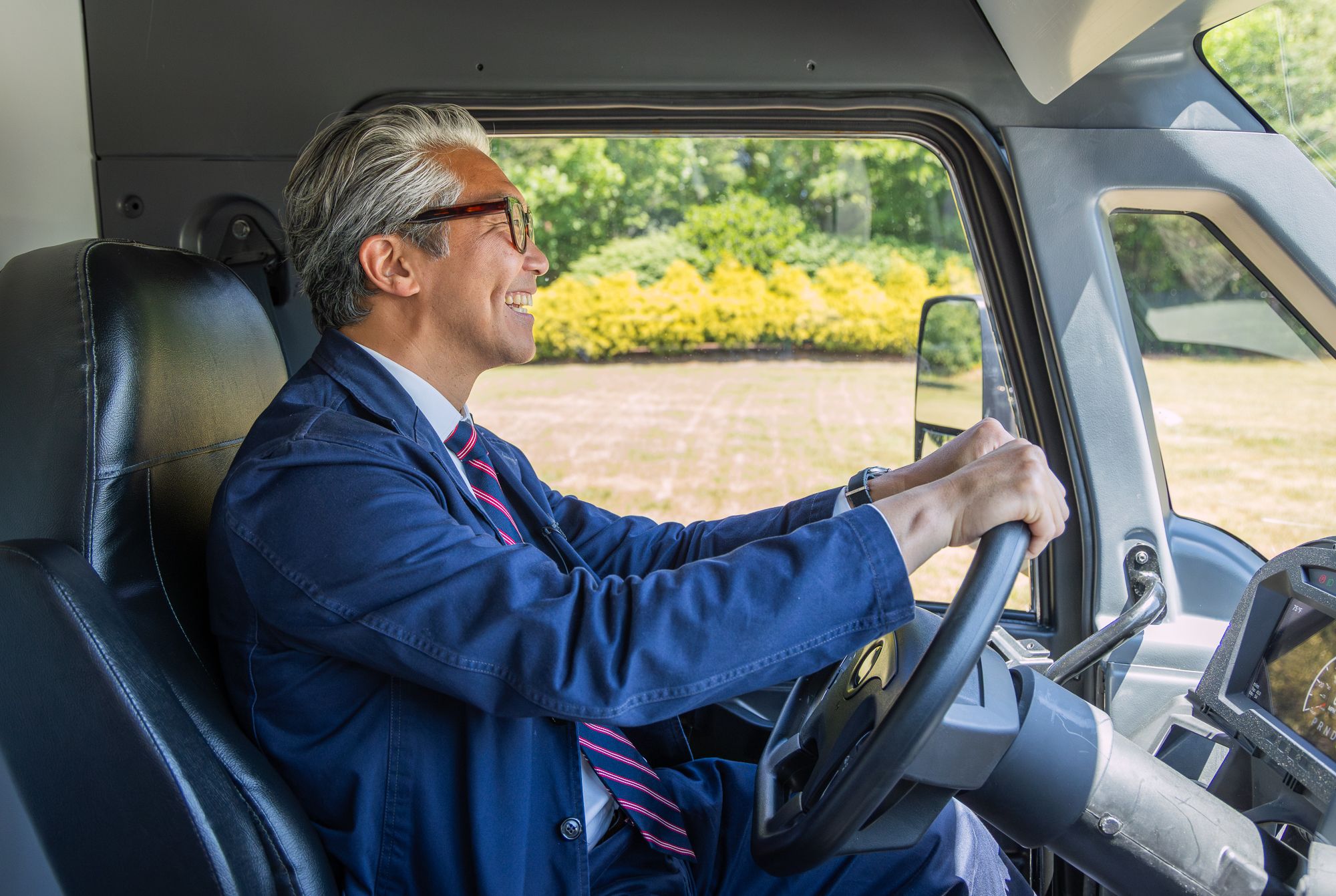 A visitor behind the wheel of MARCUS, driving it for the first time