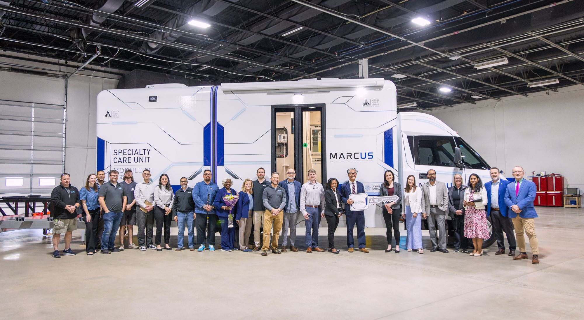 The Team MARCUS and ARPA-H group gathered in front of the finished Specialty Care Unit