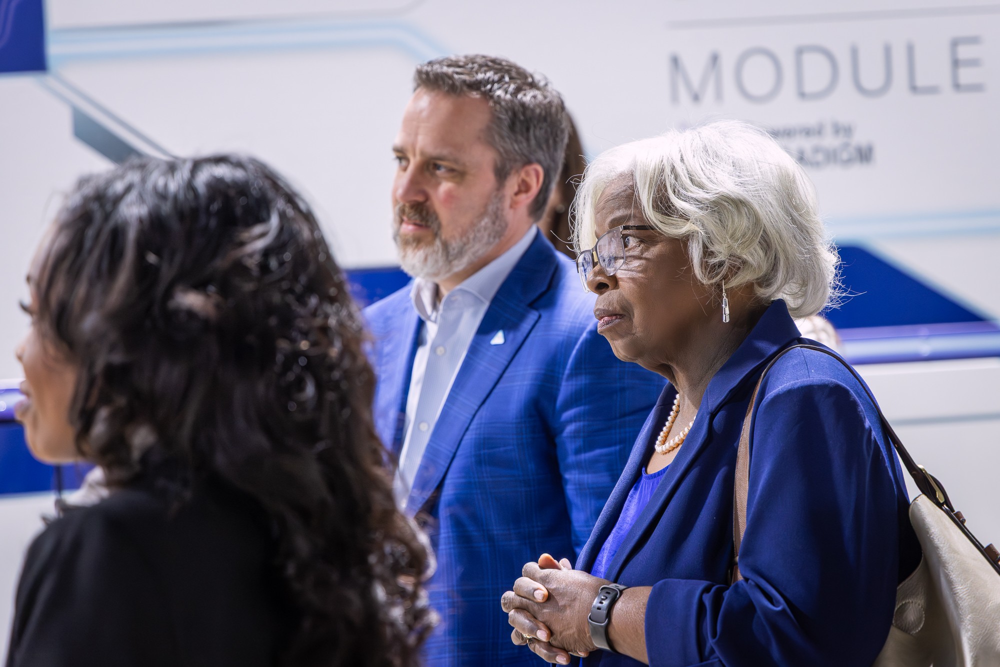 Guests talking beside the MARCUS module during the demo day visit
