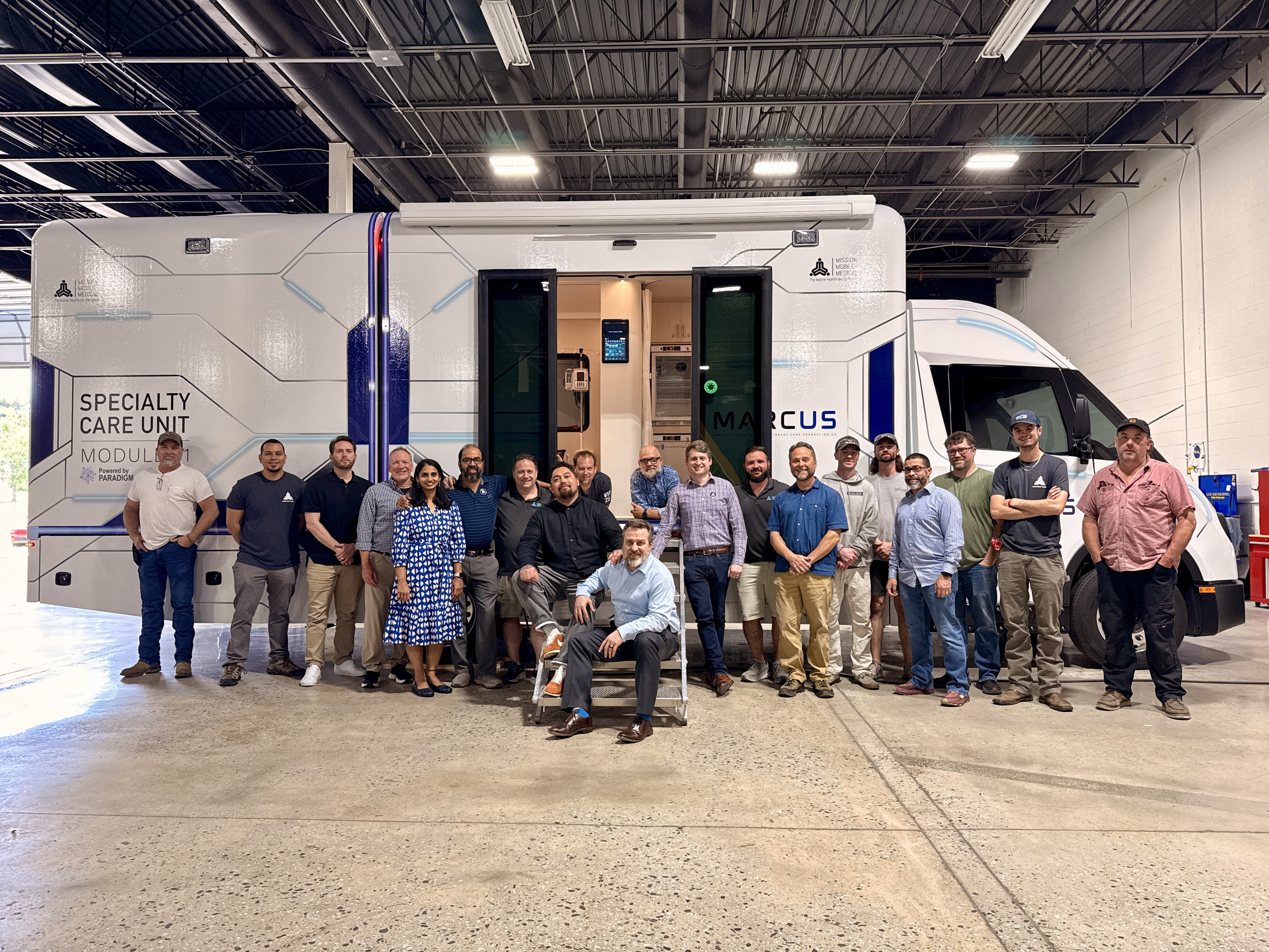The full Team MARCUS and ARPA-H group standing together in front of the finished Specialty Care Unit, Module 01